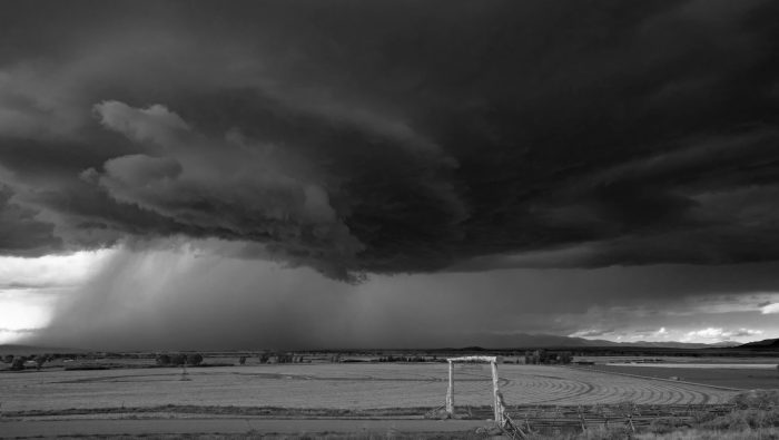 A dark storm is moving across the high plains of Montana