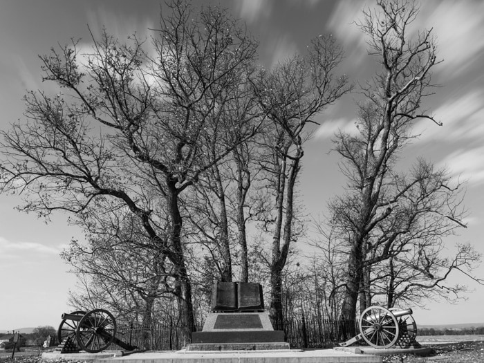 2 Canons and an open book monument sit in the copse of trees that mark the point where the Confederate Army came closest to breaking the Union lines.